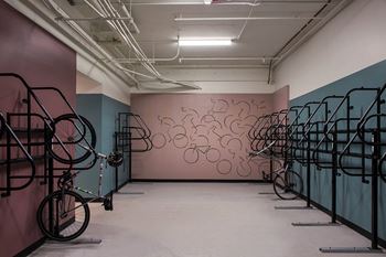 a room with bikes and a mural on the wall at The Flat, California